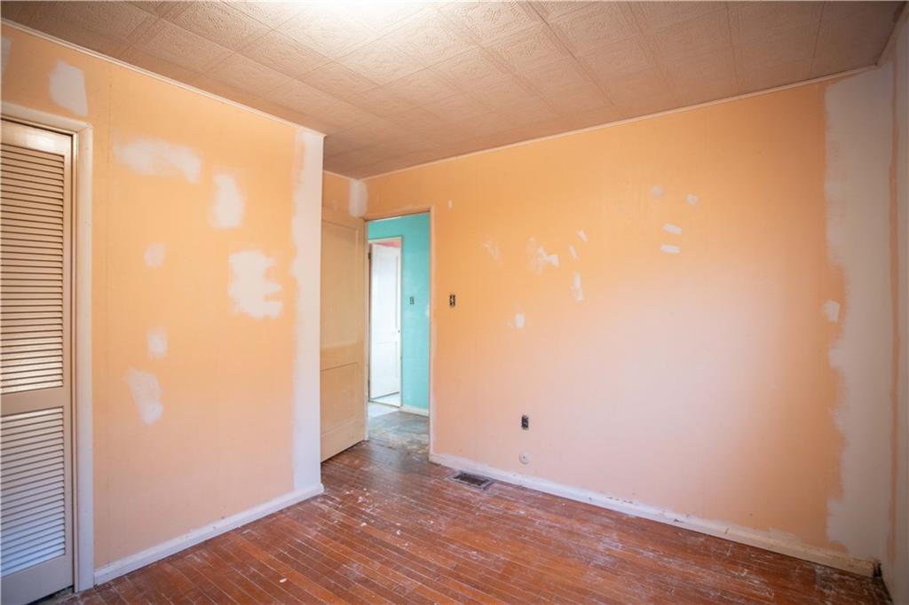 802 Summit Avenue Monaca, PA 15061 - Photo 11 of 23 a view of an empty room with wooden floor