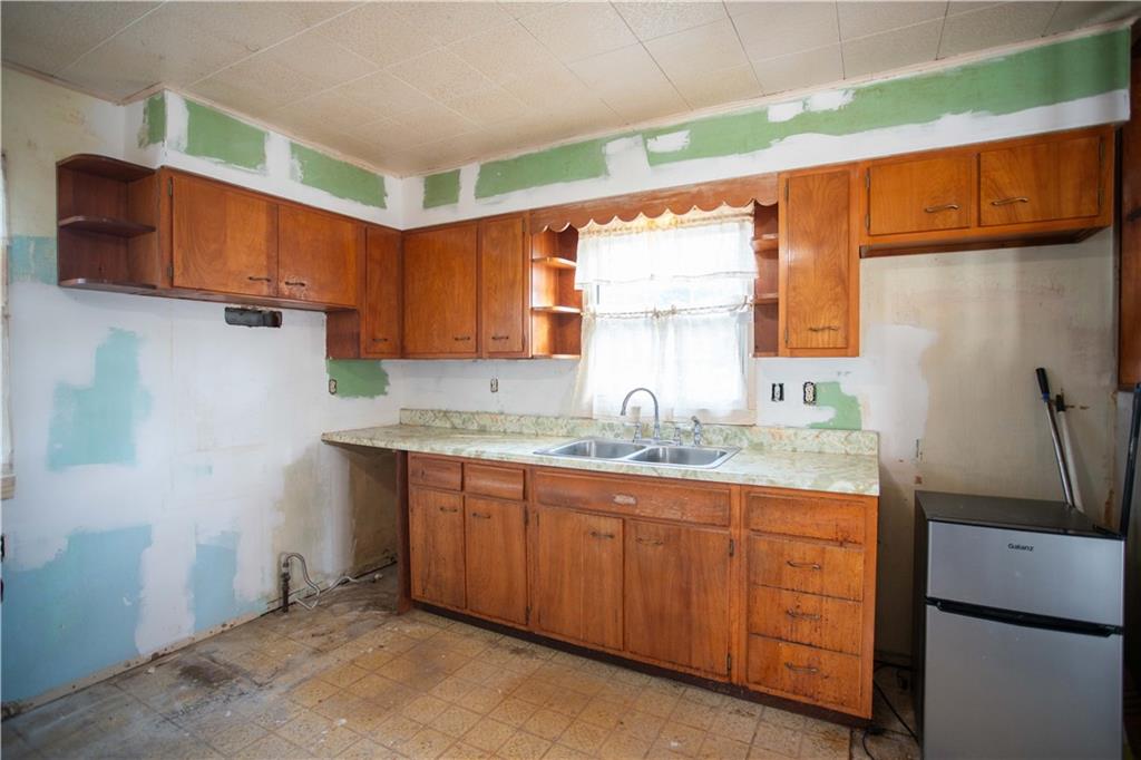 802 Summit Avenue Monaca, PA 15061 - Photo 6 of 23 a kitchen with stainless steel appliances granite countertop a sink window and cabinets