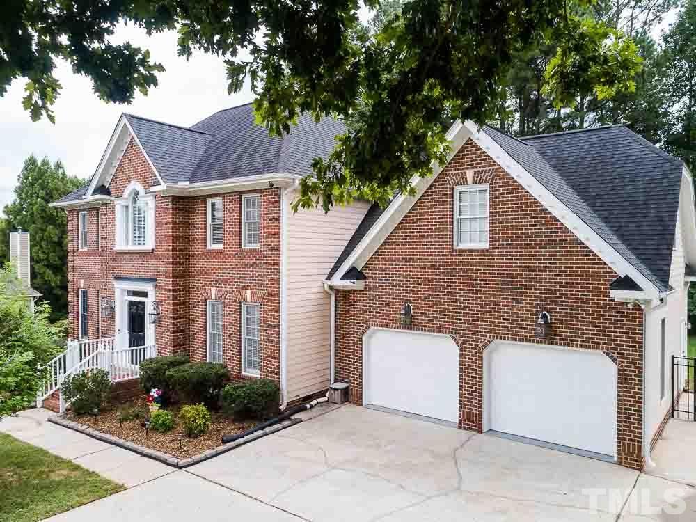 5208 Coffee Tree Drive Raleigh, NC 27613 - Photo 47 of 49 a view of a house with a yard