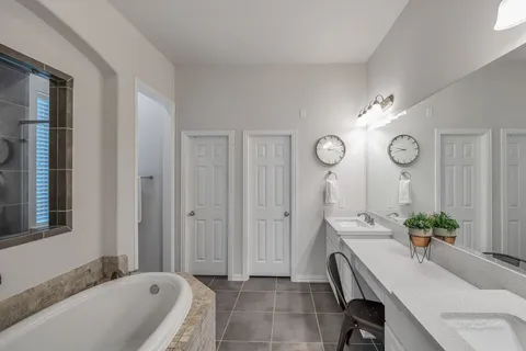a living room with furniture a chandelier a mirror and a window