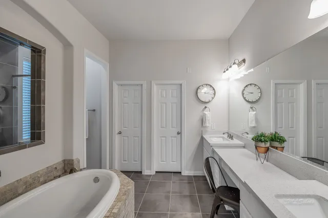 a living room with furniture a chandelier a mirror and a window
