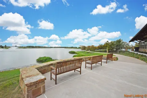 a view of a swimming pool with a lake view