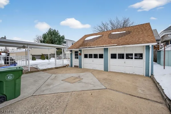 a kitchen with stainless steel appliances granite countertop a stove top oven a sink a counter space and cabinets