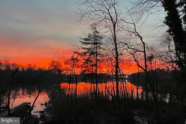 a view of swimming pool and a yard