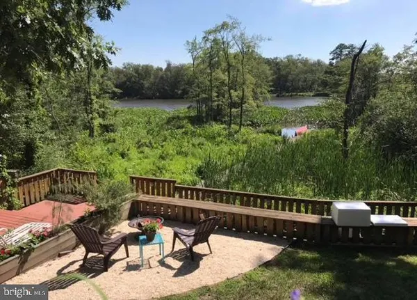 a view of a wooden deck with furniture