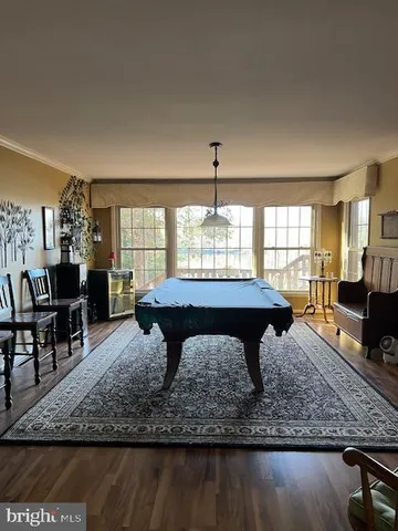 a living room with furniture a window and a table