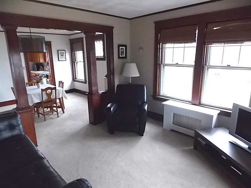 56 Richland Road Cranston, RI 02910 - Photo 5 of 20 Living Room. Another view of the living room. The brightness effects the camera shot, creating darker shadows on the furnishings. The home is actually very bright.