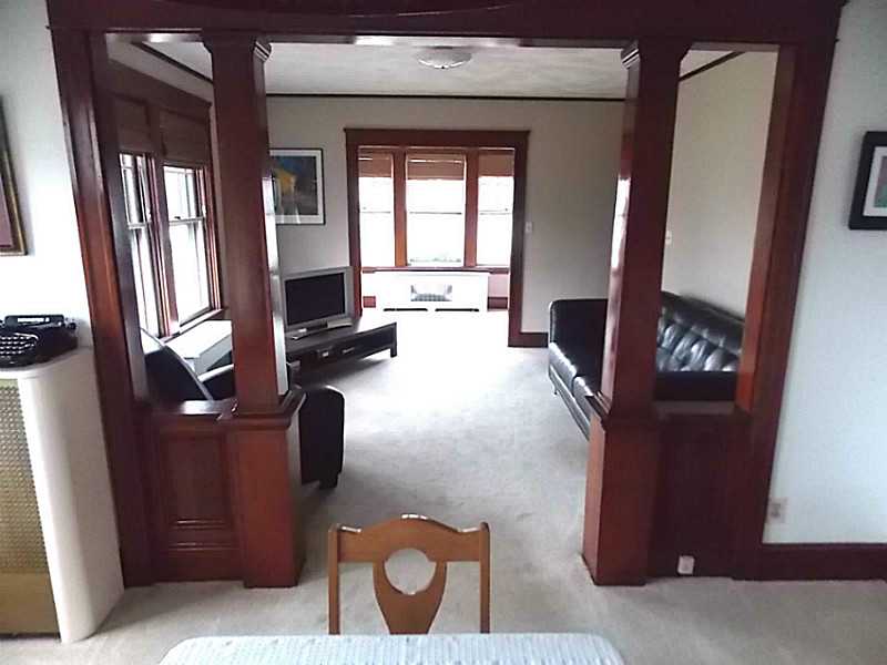 56 Richland Road Cranston, RI 02910 - Photo 7 of 20 Living Room. View back from the dining room through the living room to the enclosed porch area.
