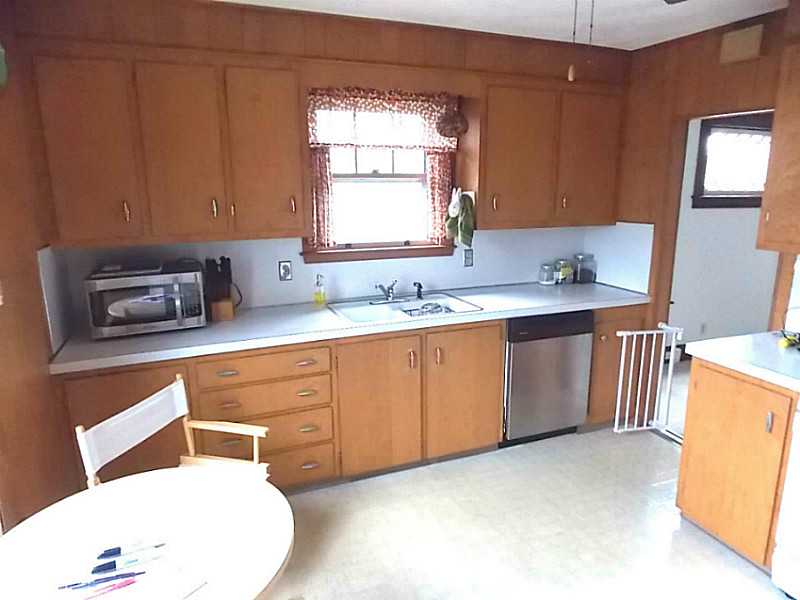 56 Richland Road Cranston, RI 02910 - Photo 10 of 20 Living Room. Second view of the kitchen area . There is generous cabinet storage space and counter top room.