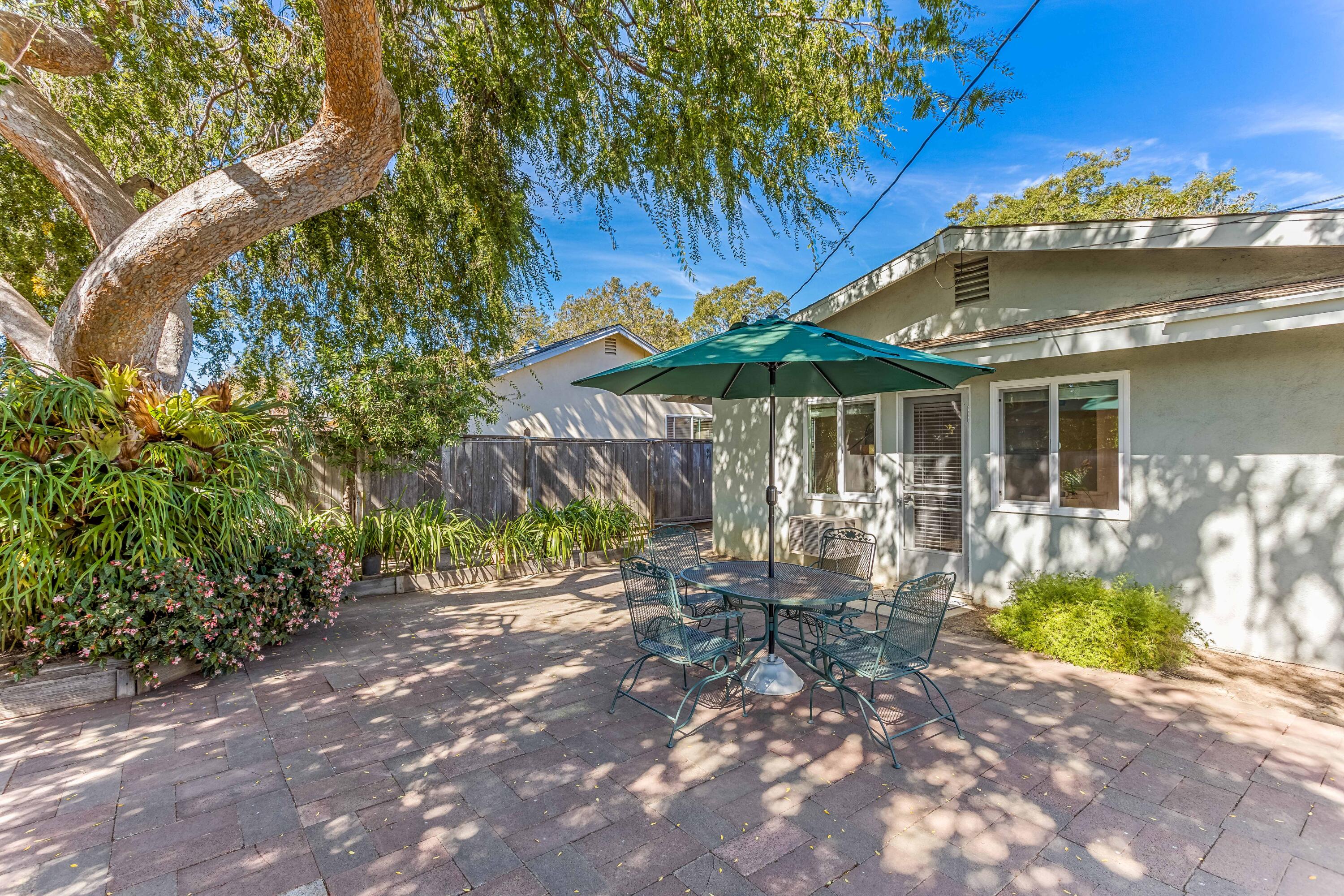 7111 Madera Drive Goleta, CA 93117 - Photo 18 of 24 a wooden bench sitting in front of a house