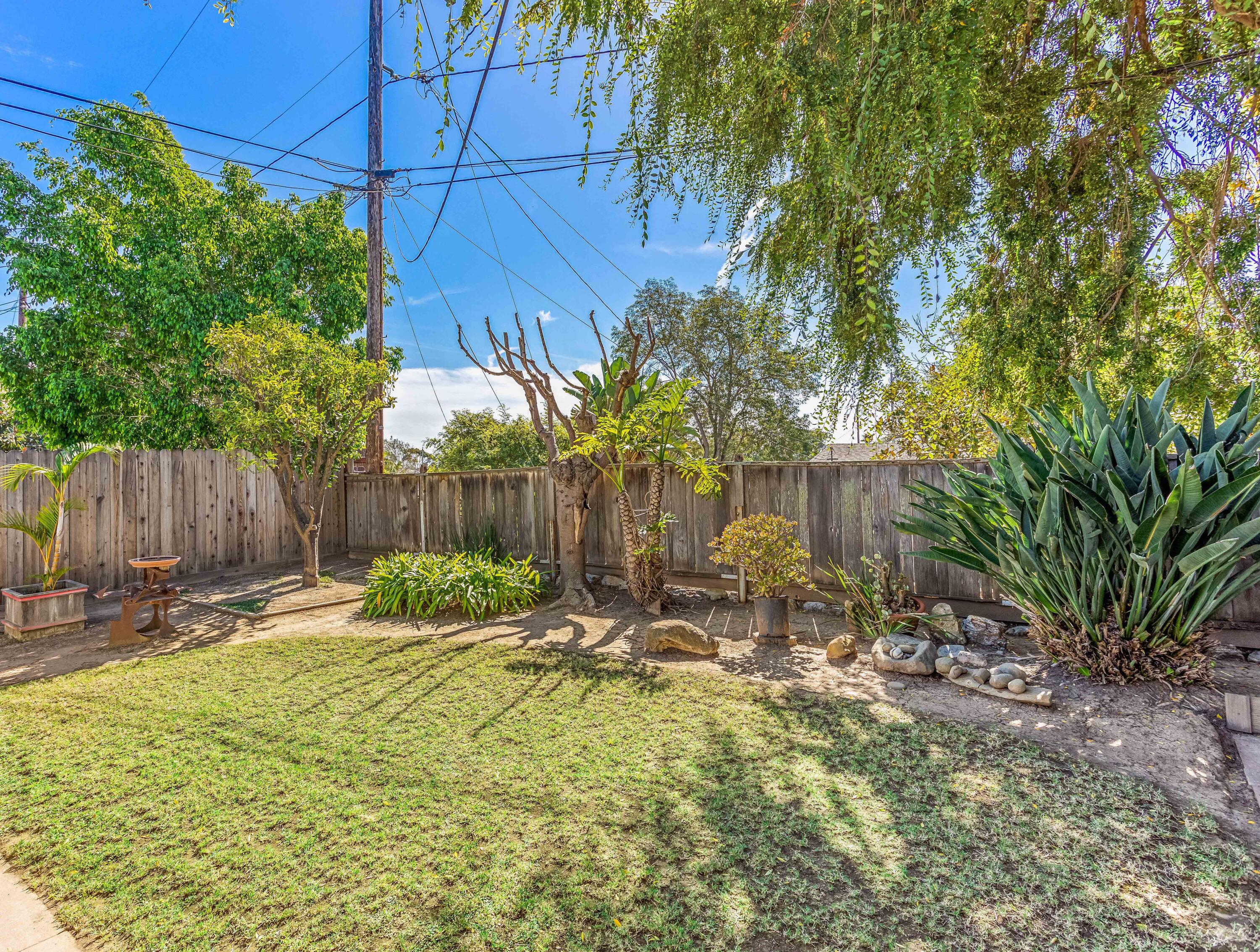 7111 Madera Drive Goleta, CA 93117 - Photo 21 of 24 a backyard of a house with table and chairs