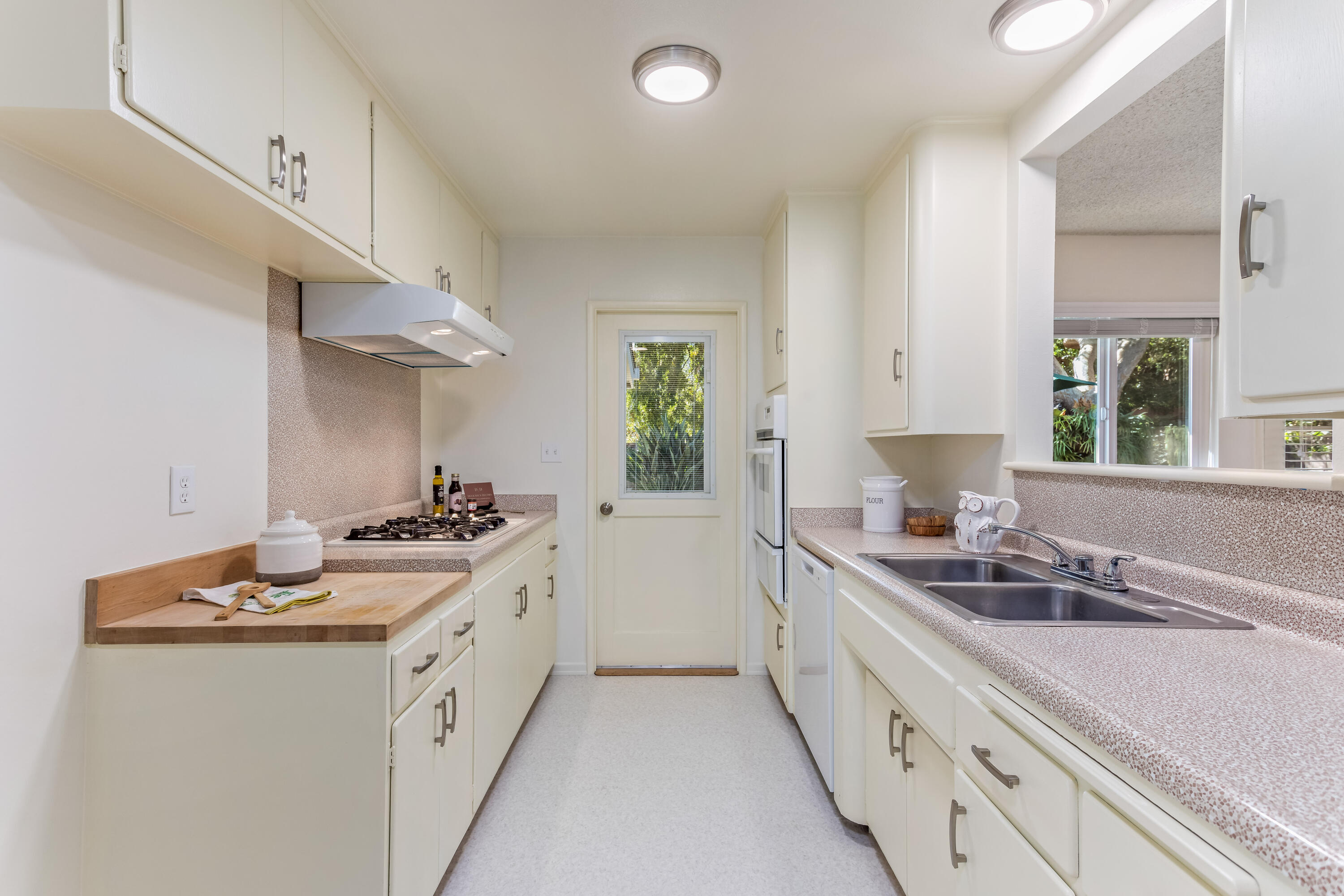 7111 Madera Drive Goleta, CA 93117 - Photo 8 of 24 a kitchen with stainless steel appliances granite countertop a sink stove and cabinets
