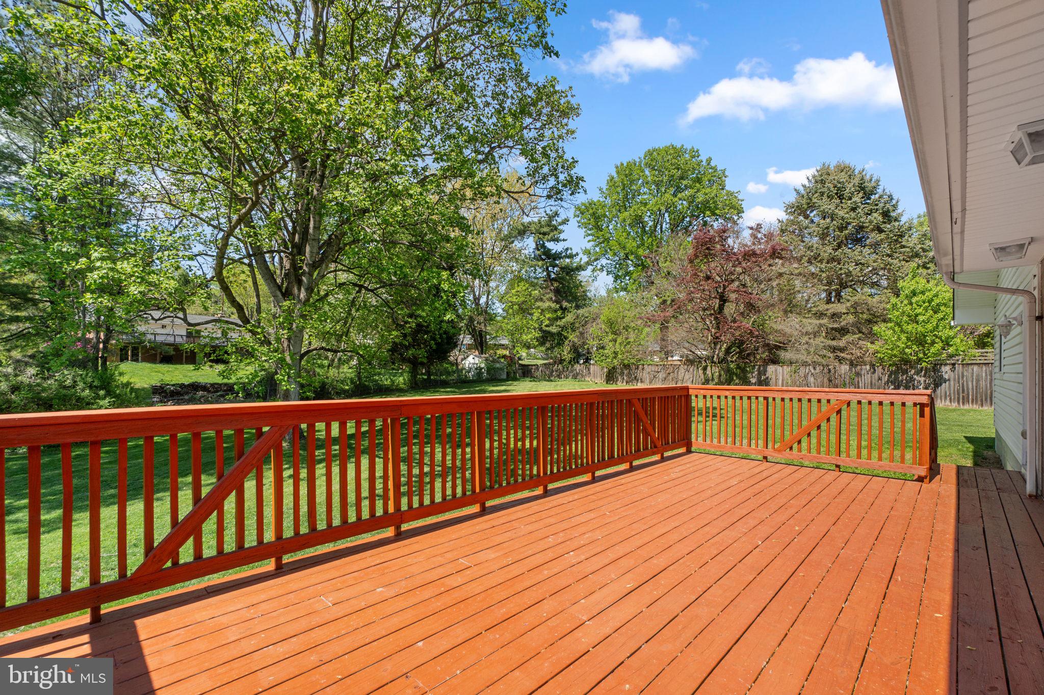 10770 West Crestview Lane Laurel, MD 20723 - Photo 45 of 49 Expansive back deck with steps down to the yard