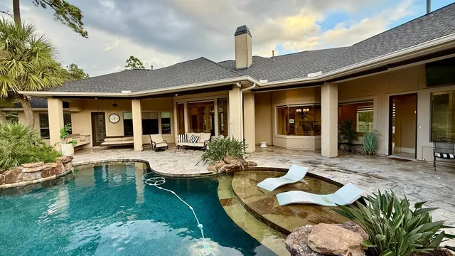 a view of a house with backyard porch and patio
