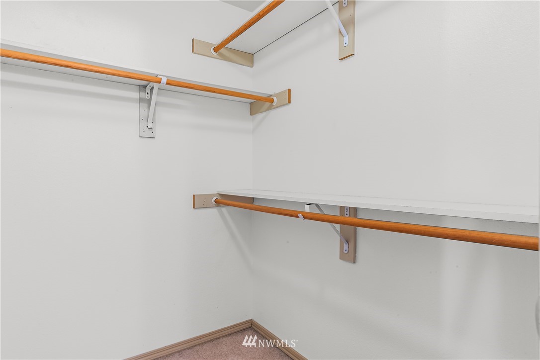 1160 Monroe Avenue Northeast, Unit A4 Renton, WA 98056 - Photo 16 of 26 a view of a room with racks on the wall