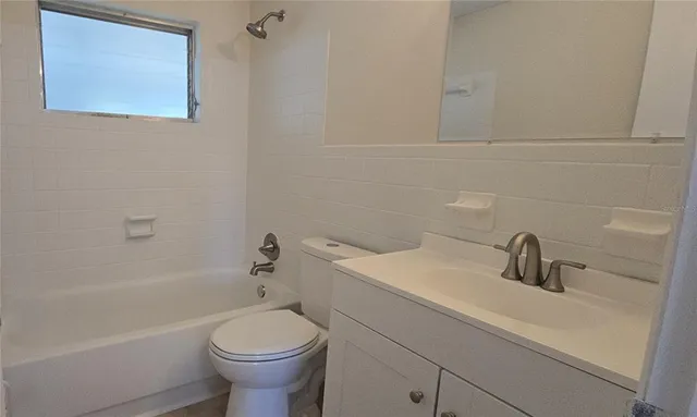 a bathroom with a sink toilet and bathtub