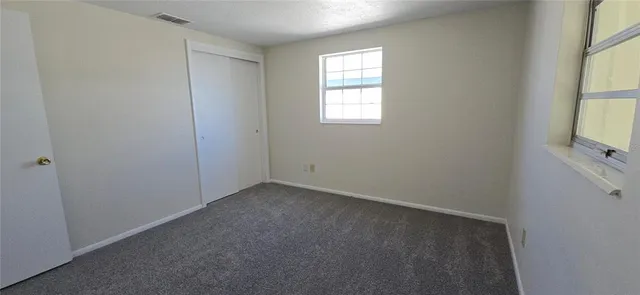 a view of hallway with windows
