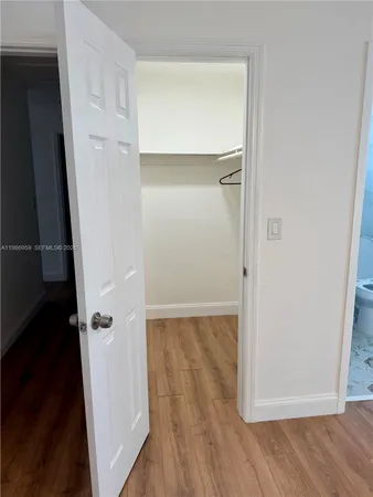 a bathroom with a toilet a sink and shower