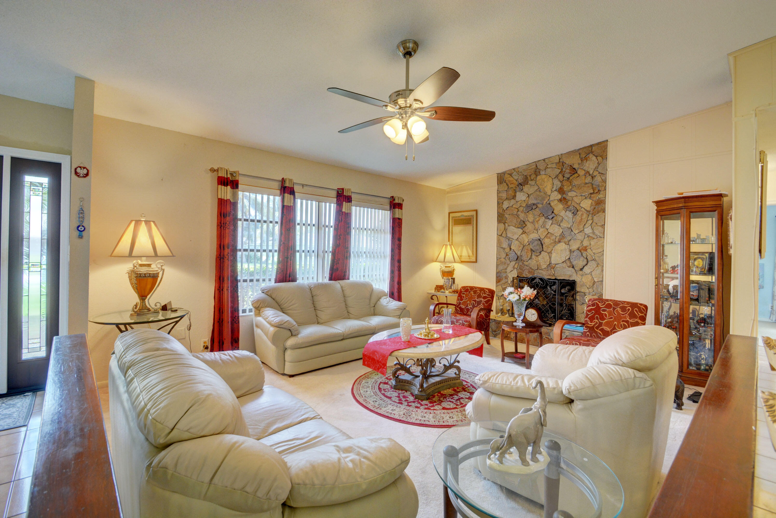 78 Southwest 12th Way Boca Raton, FL 33486 - Photo 6 of 34 a living room with furniture and a large window