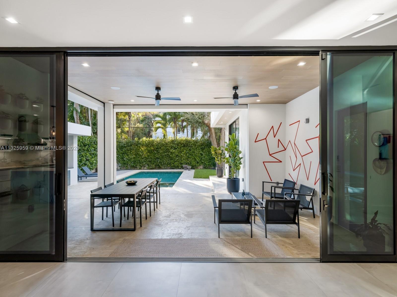 7260 School House Road Miami, FL 33143 - Photo 14 of 44 a living room with furniture and a large window