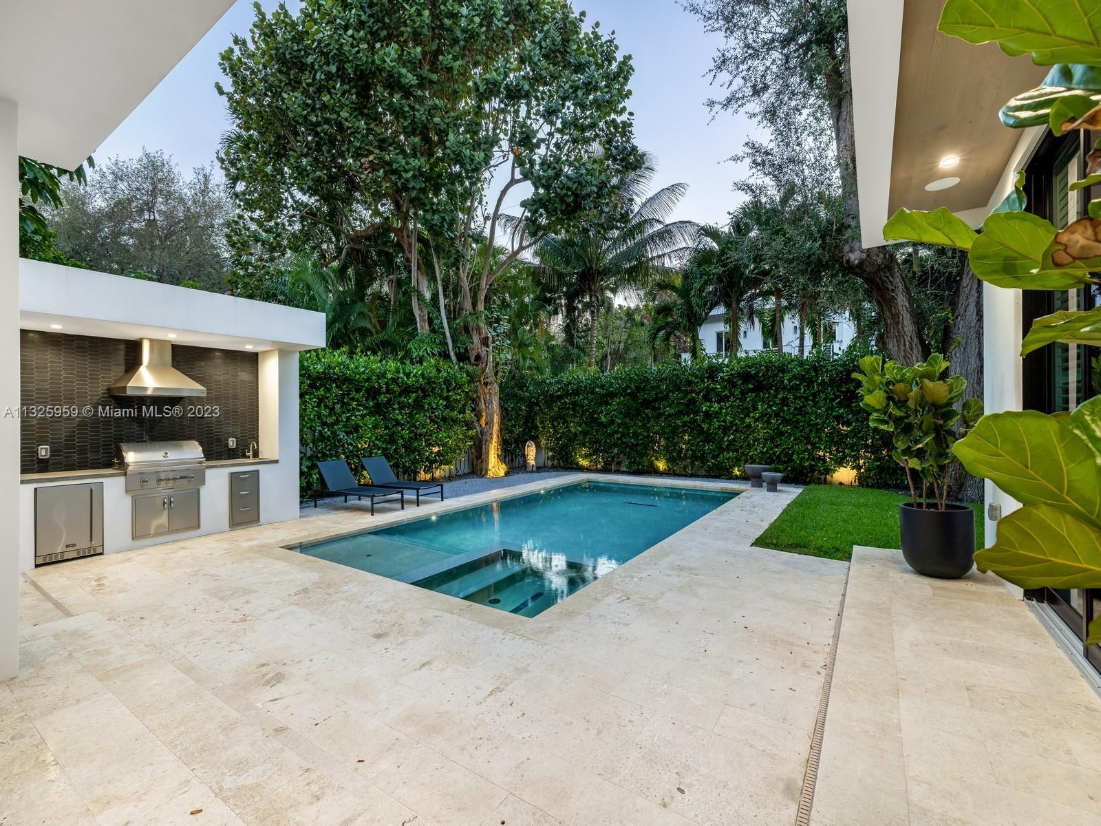 7260 School House Road Miami, FL 33143 - Photo 17 of 44 a view of a backyard and a garden