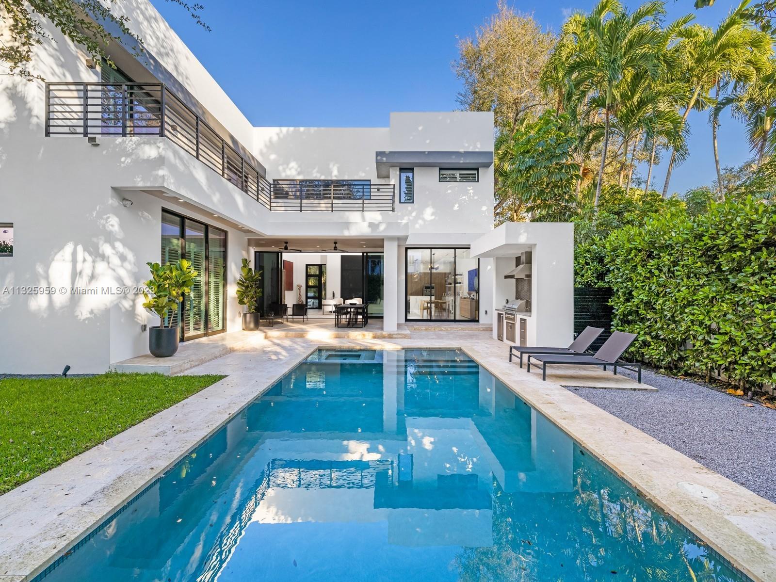 7260 School House Road Miami, FL 33143 - Photo 18 of 44 a view of a house with swimming pool and sitting area