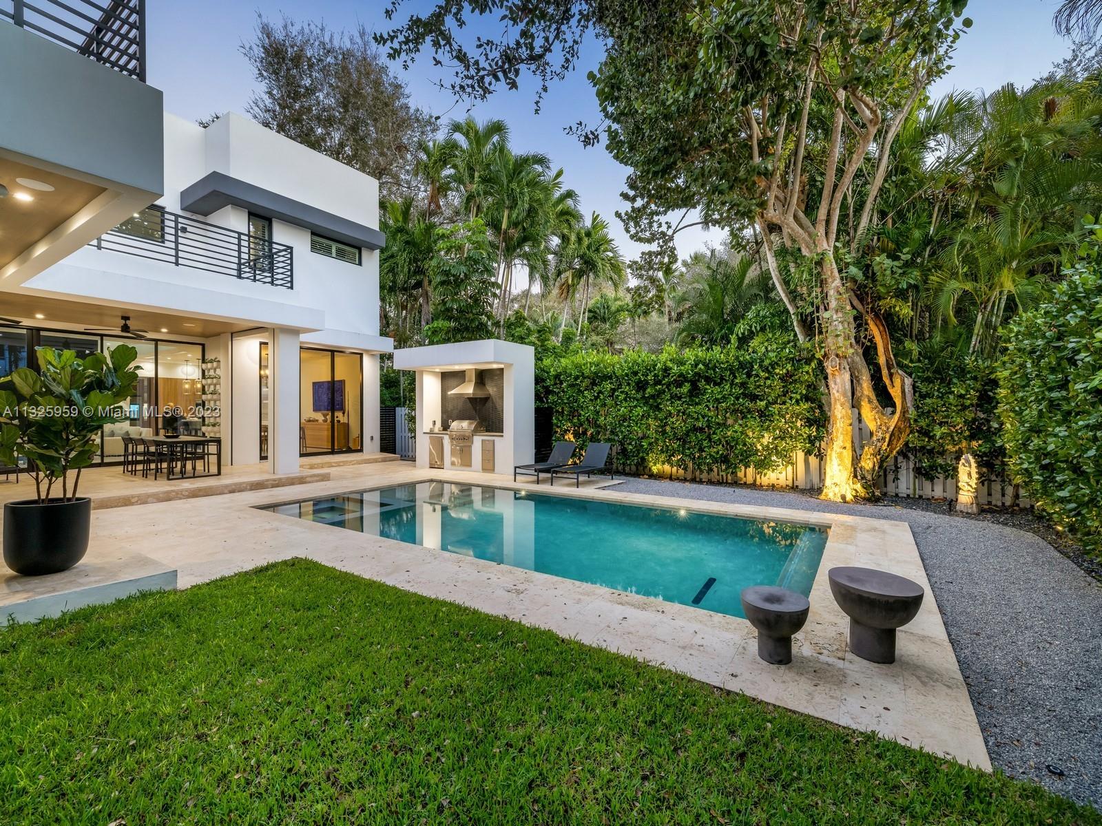 7260 School House Road Miami, FL 33143 - Photo 19 of 44 a view of a house with a yard porch and sitting area