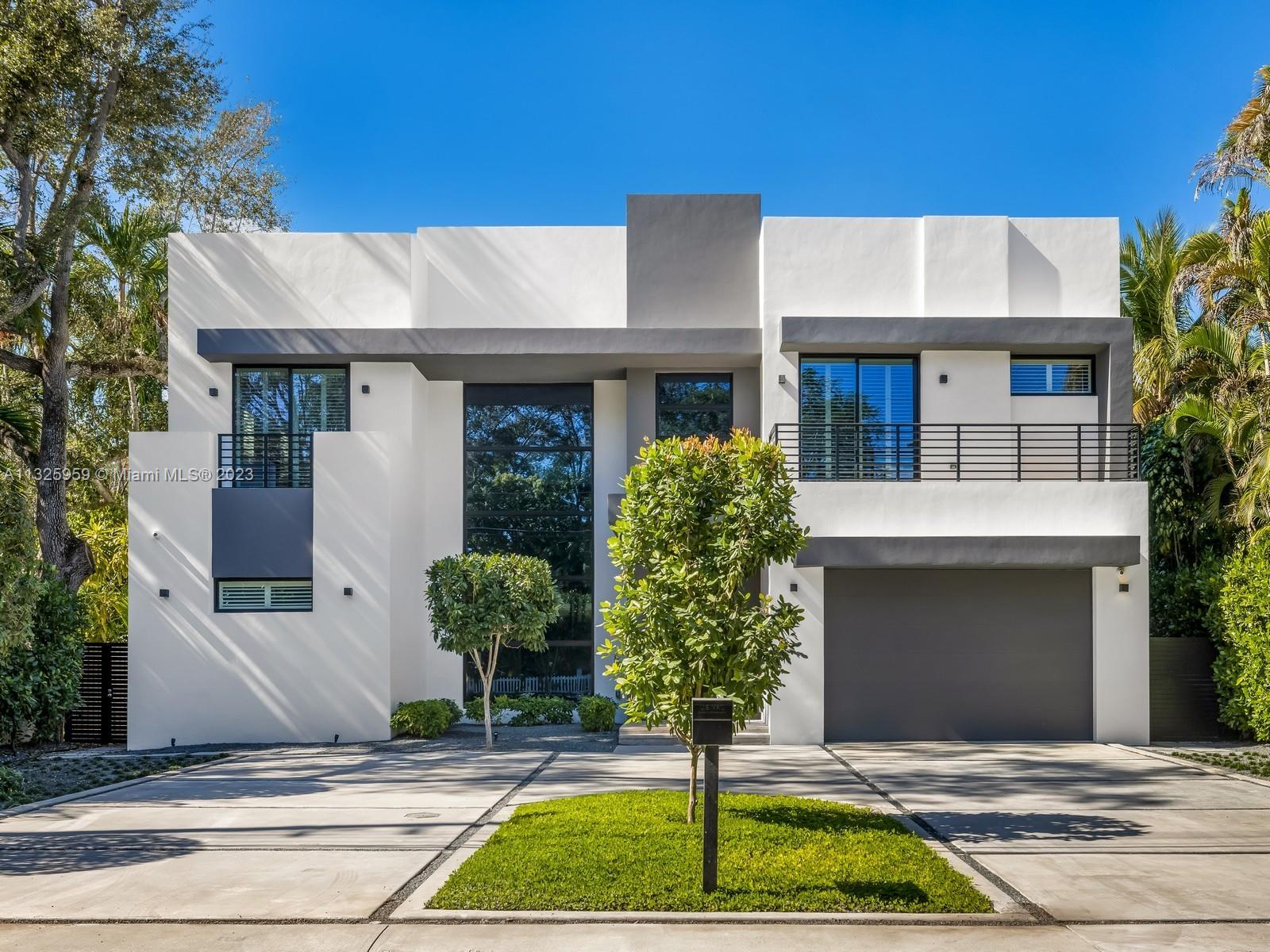 7260 School House Road Miami, FL 33143 - Photo 2 of 44 a front view of a house with garden
