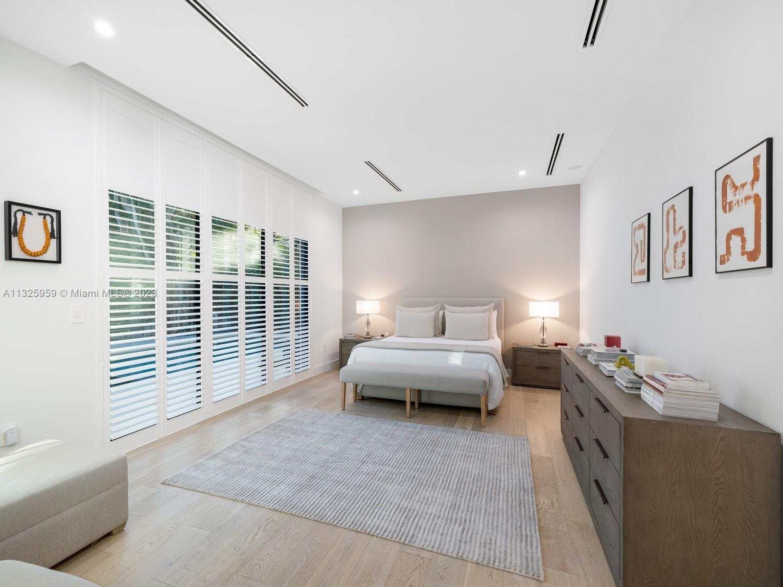 7260 School House Road Miami, FL 33143 - Photo 22 of 44 a spacious bedroom with furniture and a large window