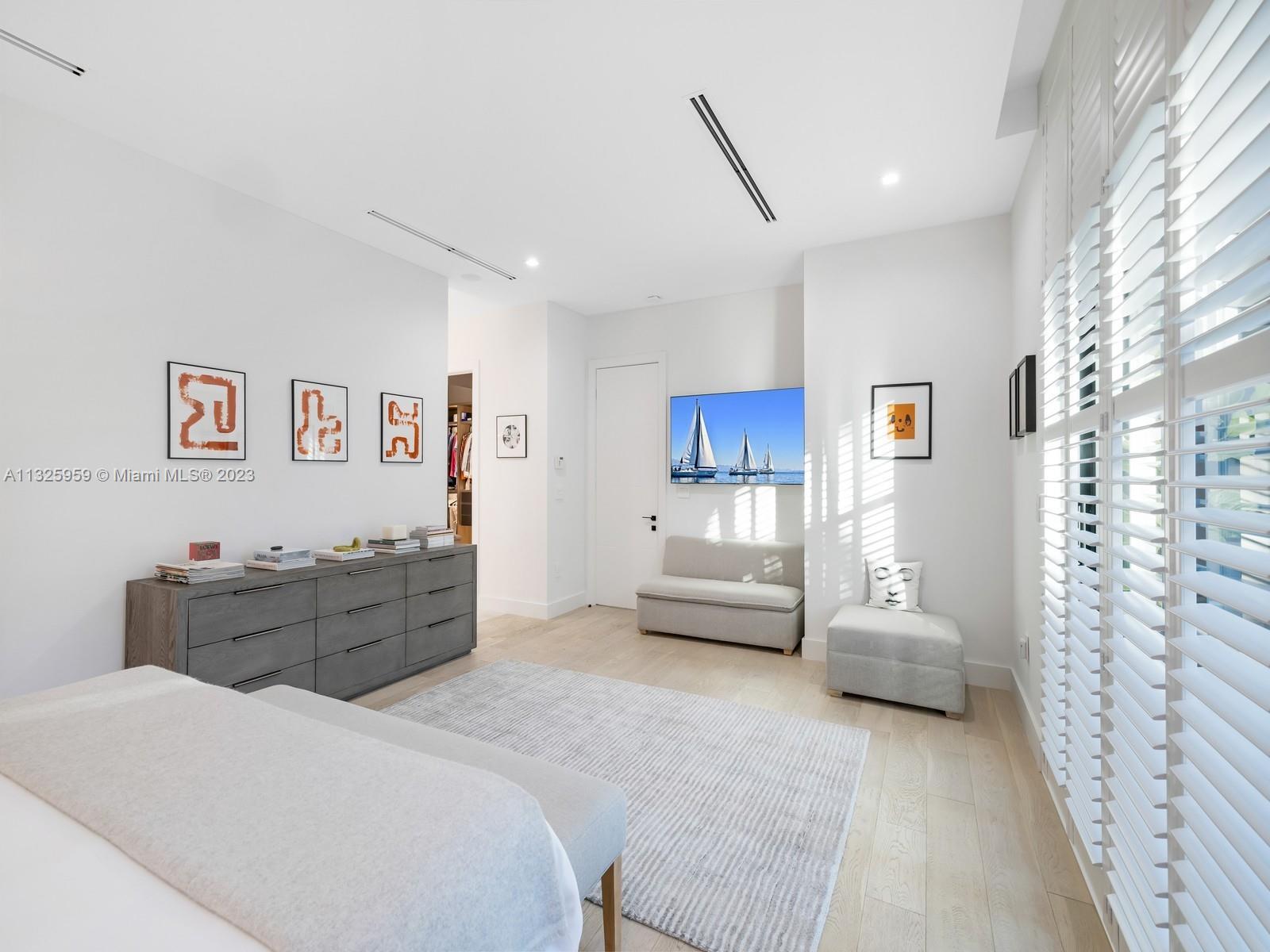 7260 School House Road Miami, FL 33143 - Photo 23 of 44 a bed room with a bed and a chair