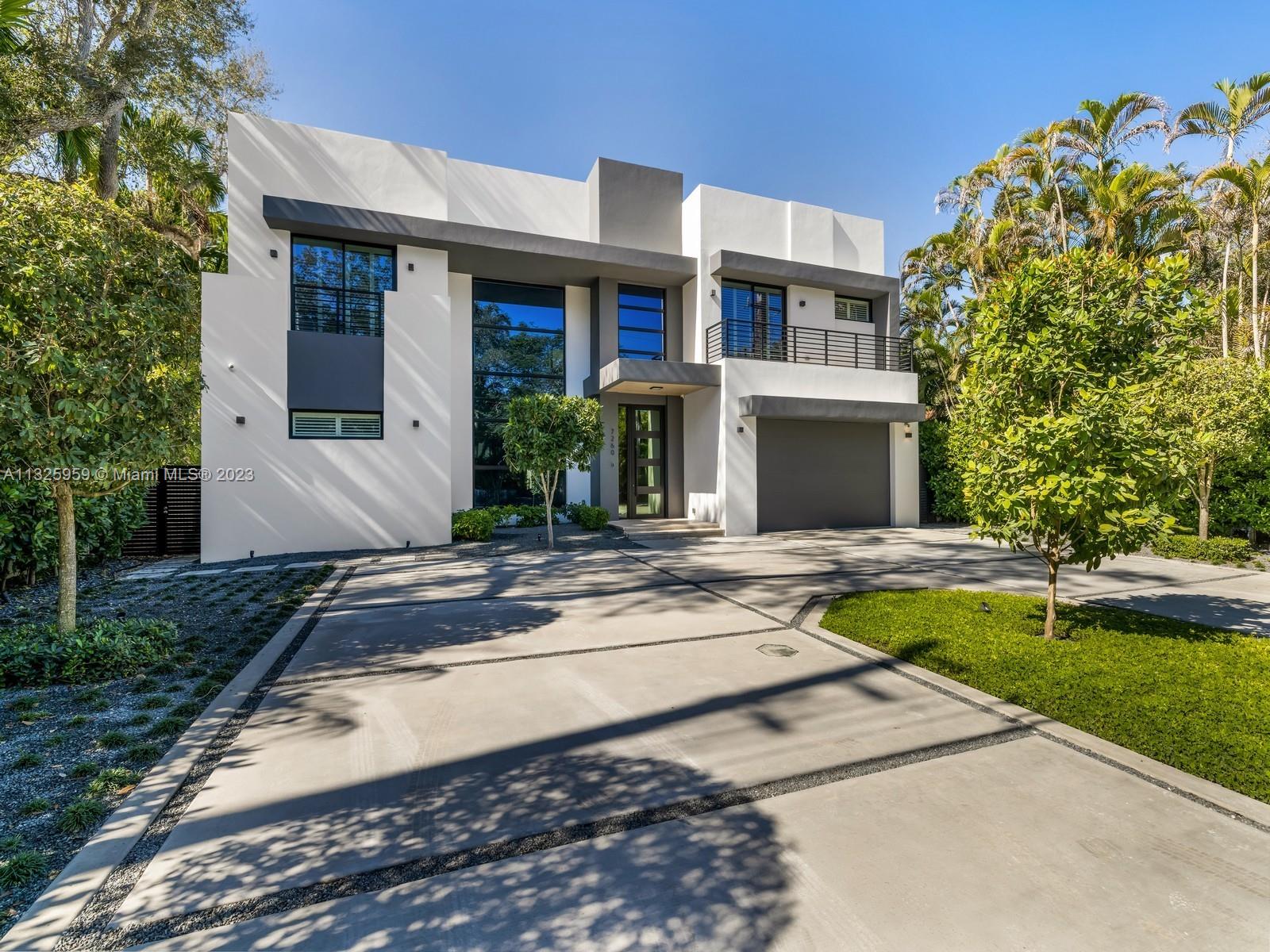 7260 School House Road Miami, FL 33143 - Photo 3 of 44 a view of a house with swimming pool and a yard
