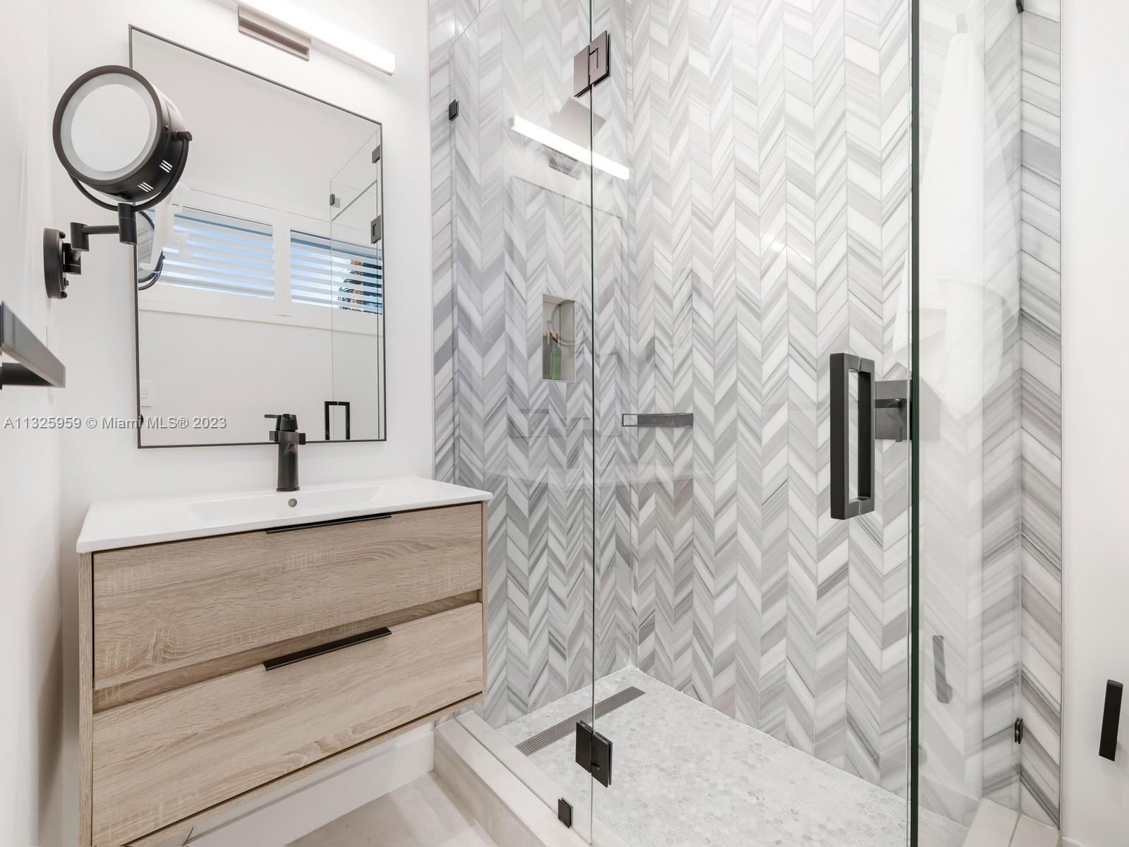 7260 School House Road Miami, FL 33143 - Photo 34 of 44 a bathroom with a sink a toilet and shower