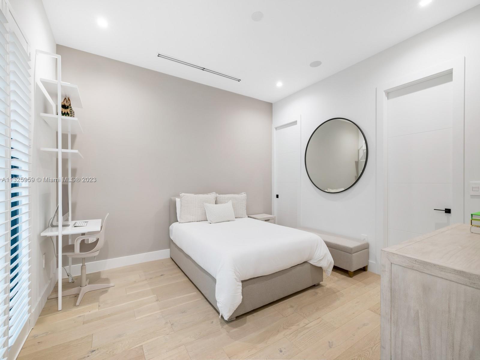 7260 School House Road Miami, FL 33143 - Photo 36 of 44 a bedroom with a bed and a mirror