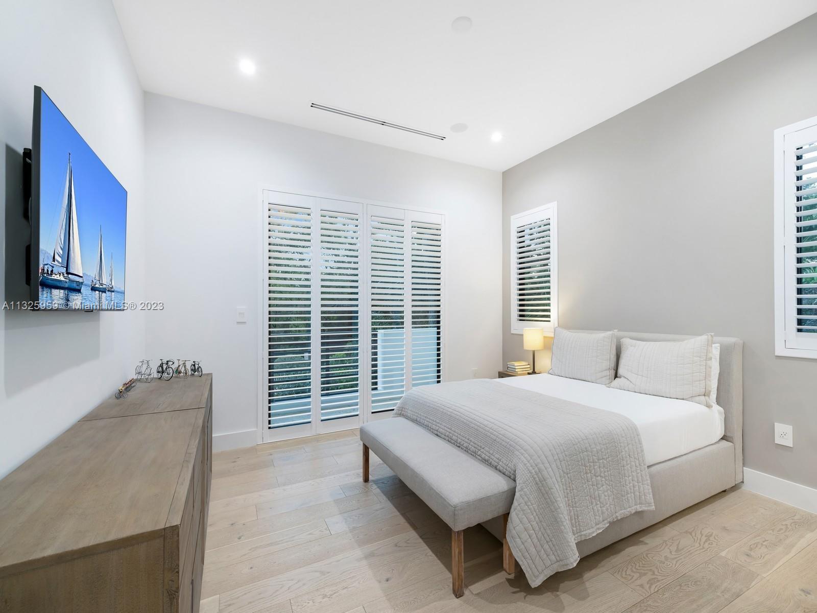 7260 School House Road Miami, FL 33143 - Photo 39 of 44 a bedroom with a bed and a dresser