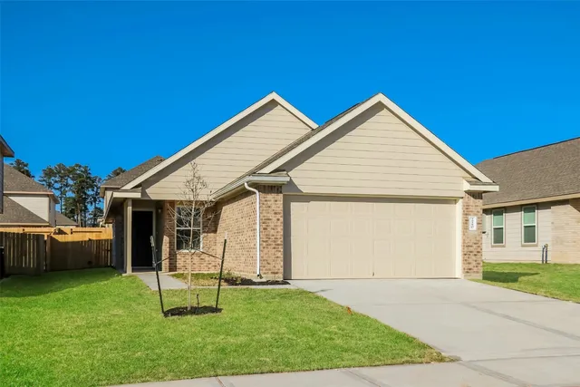 a view of backyard of house with outdoor seating and green space