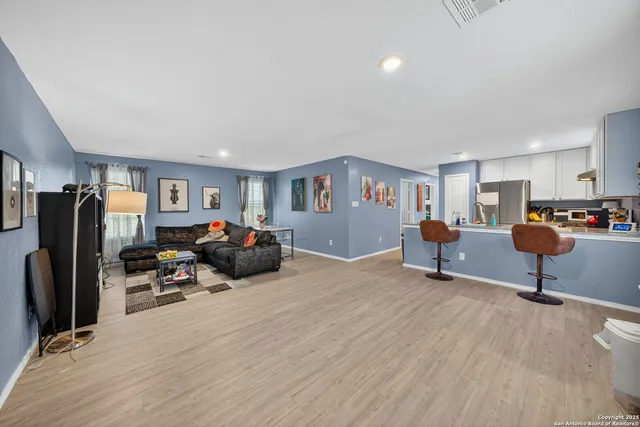 a bed room with furniture and a tv