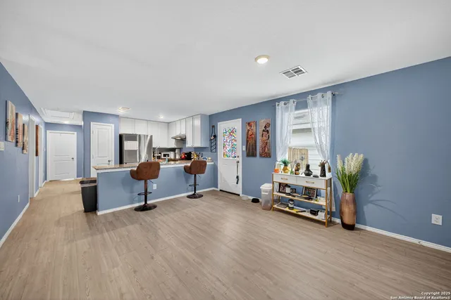 a living room with furniture and a table