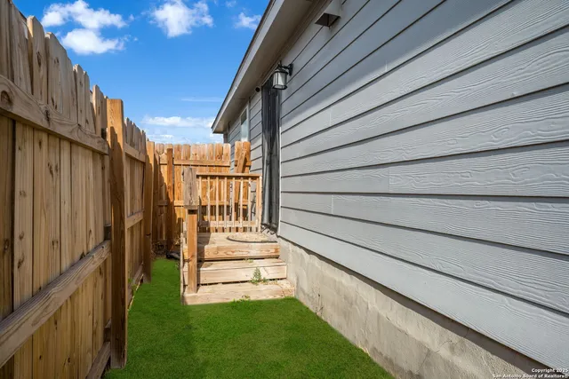 a view of back yard of a house