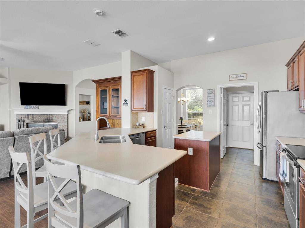 205 King George Road Ponder, TX 76259 - Photo 12 of 32 a view of a dining room with furniture window and wooden floor