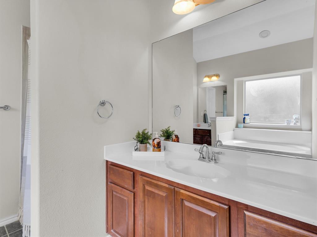 205 King George Road Ponder, TX 76259 - Photo 18 of 32 a bathroom with a sink and a mirror
