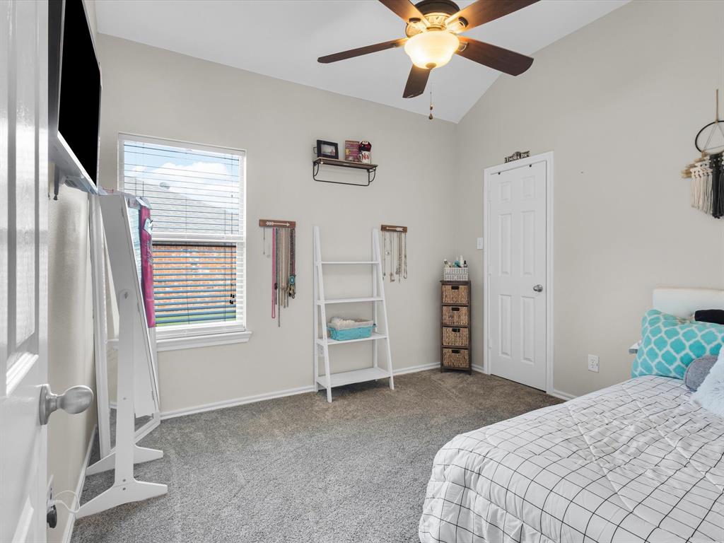 205 King George Road Ponder, TX 76259 - Photo 20 of 32 a bedroom with a bed and a ceiling fan