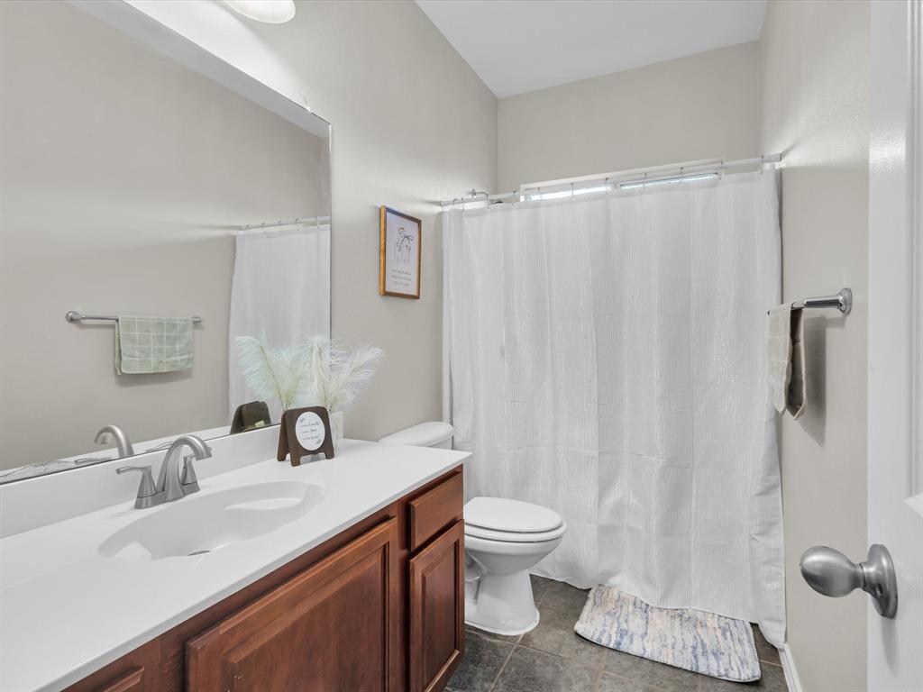 205 King George Road Ponder, TX 76259 - Photo 23 of 32 a bathroom with a sink toilet and shower