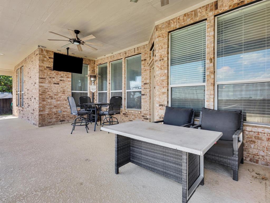 205 King George Road Ponder, TX 76259 - Photo 25 of 32 a outdoor space with a couch and a fireplace