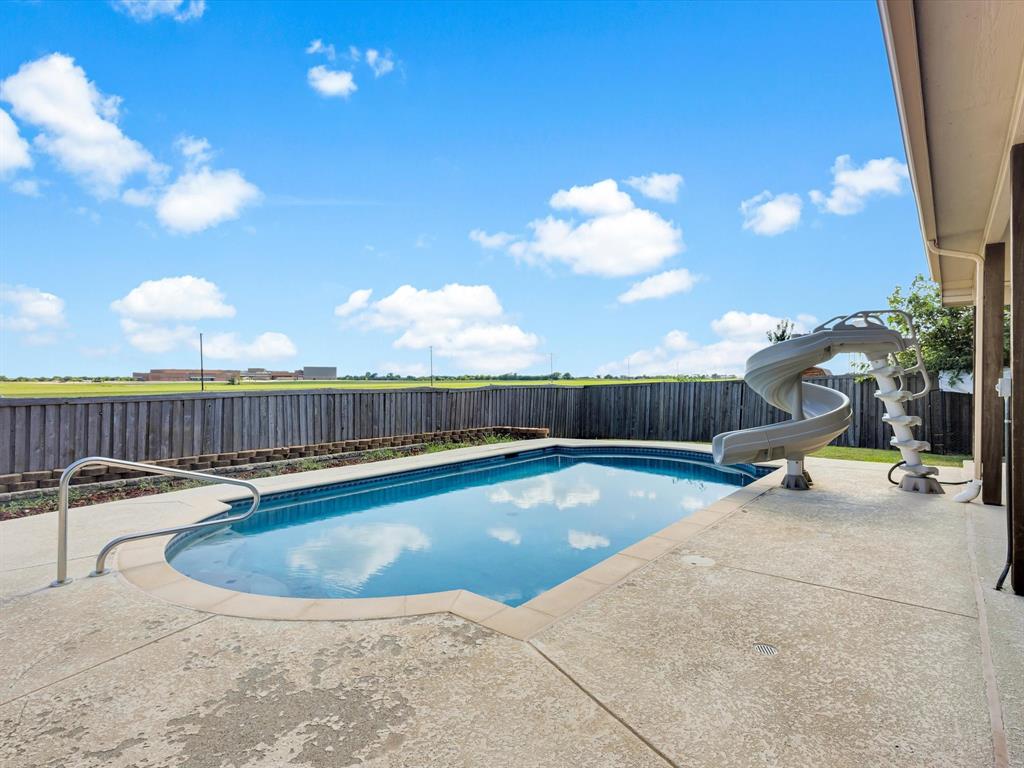 205 King George Road Ponder, TX 76259 - Photo 26 of 32 a view of a swimming pool with lounge chairs