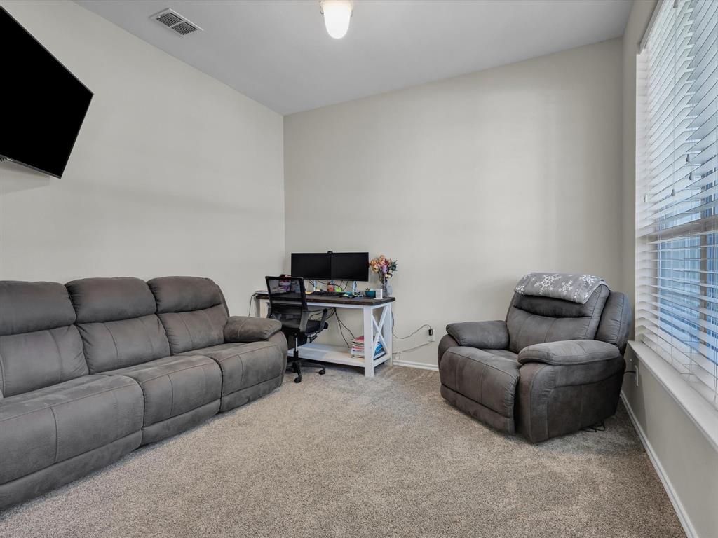 205 King George Road Ponder, TX 76259 - Photo 4 of 32 a living room with furniture and a flat screen tv