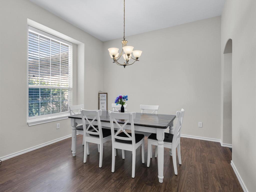 205 King George Road Ponder, TX 76259 - Photo 5 of 32 a view of a dining room with furniture a chandelier and wooden floor
