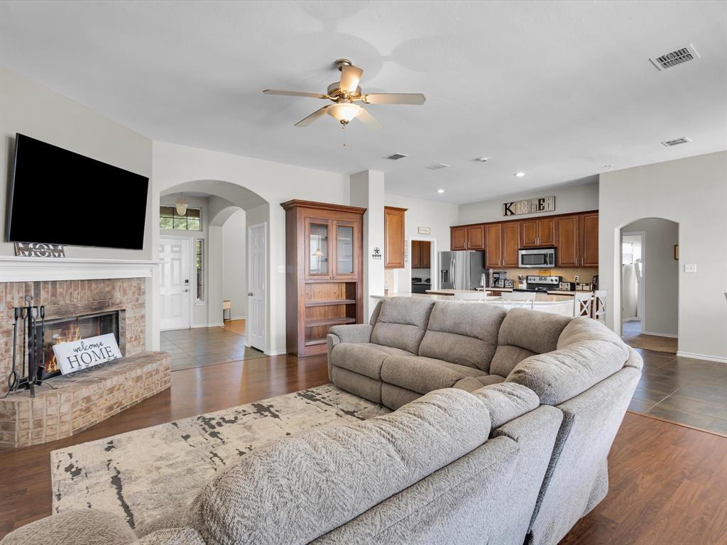205 King George Road Ponder, TX 76259 - Photo 6 of 32 a living room with furniture fireplace and flat screen tv