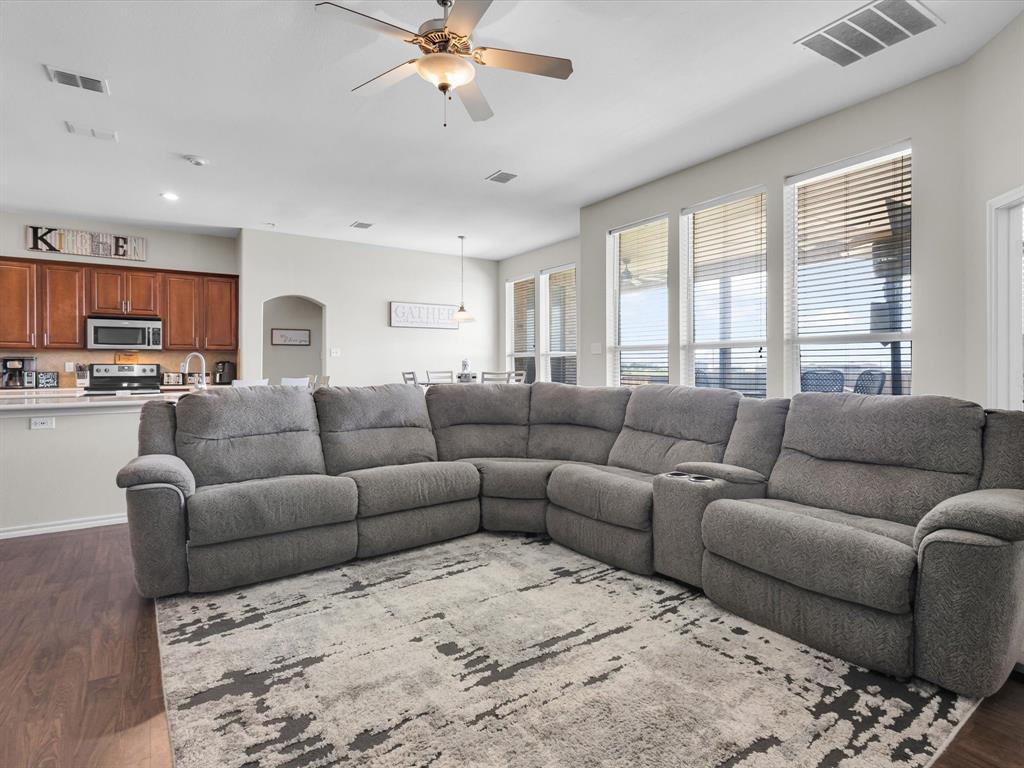 205 King George Road Ponder, TX 76259 - Photo 7 of 32 a living room with furniture and kitchen view