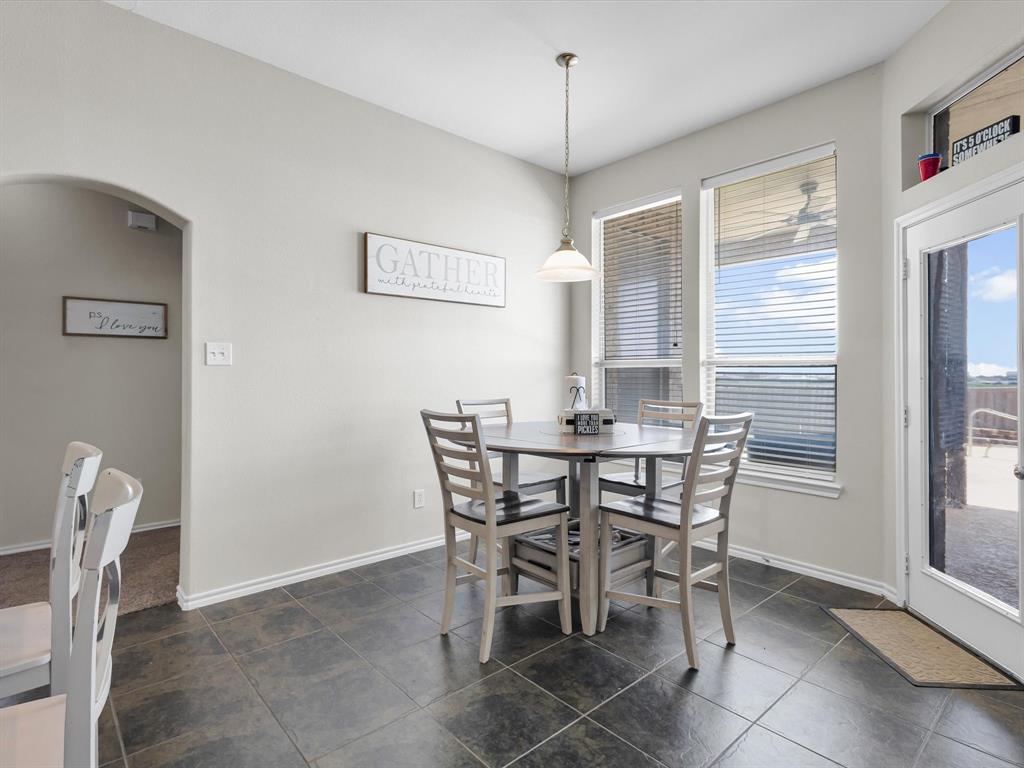 205 King George Road Ponder, TX 76259 - Photo 10 of 32 a view of a dining room with furniture and window