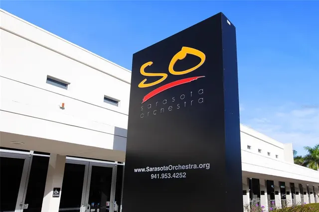 a view of a building with potted plants